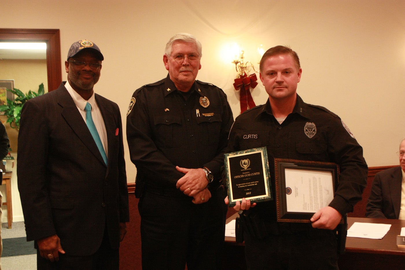 Wilmore Police Officer Guss Curtis was recognized Monday night at the Wilmore City Council meeting for intervening in an altercation at a Lexington-area restaurant while he was off duty late last month. Presenting him with the award was William “Sarge” Farris, the director of the Legends Boxing Club, and Wilmore Police Chief William Craig.